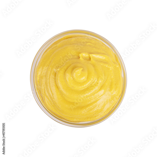 Mustard sauce in ceramic white bowl isolated on white background.