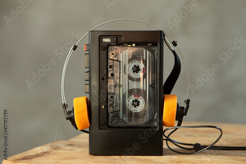 Music listening concept. Vintage cassette tape, audio player and headphones. photo