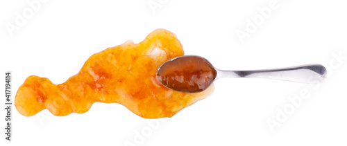 Spoon with sweet jam isolated on white background