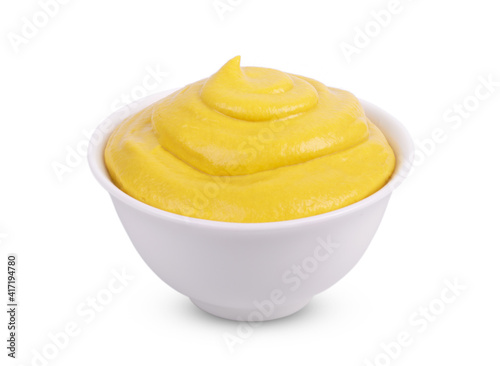 Mustard tasty sauce in bowl isolated on white background.