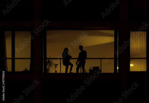 silhouettes of people from window