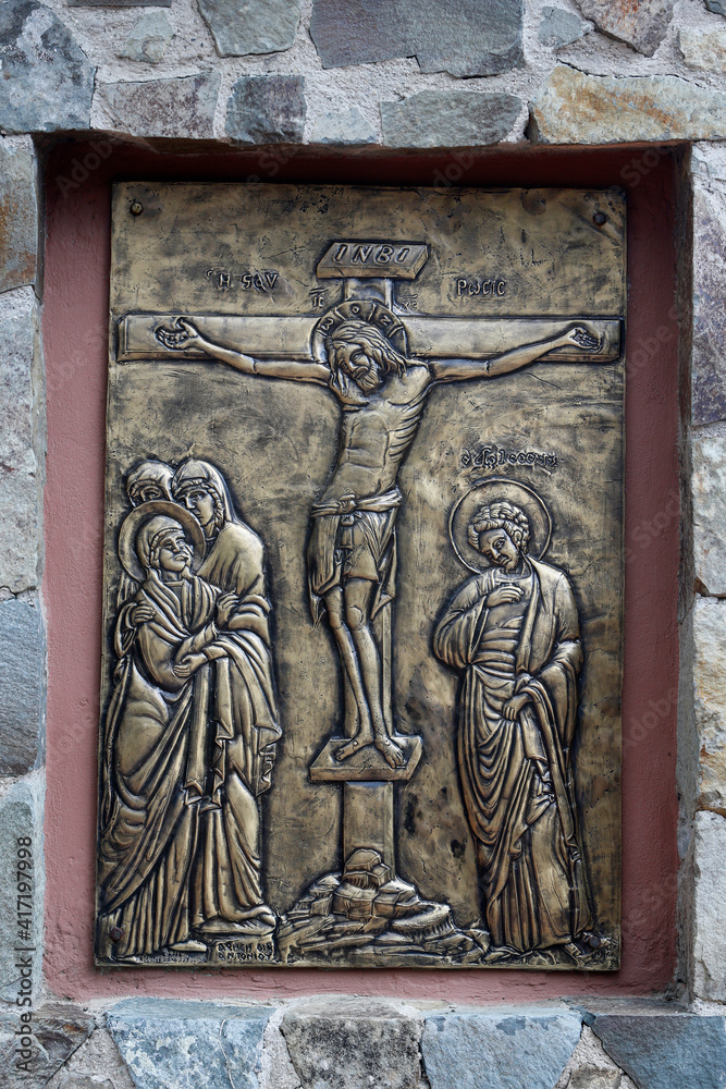 Relief outside Holy cross church, Pedoulas, Cyprus. Jesus Christ on the cross. 22.03.2018