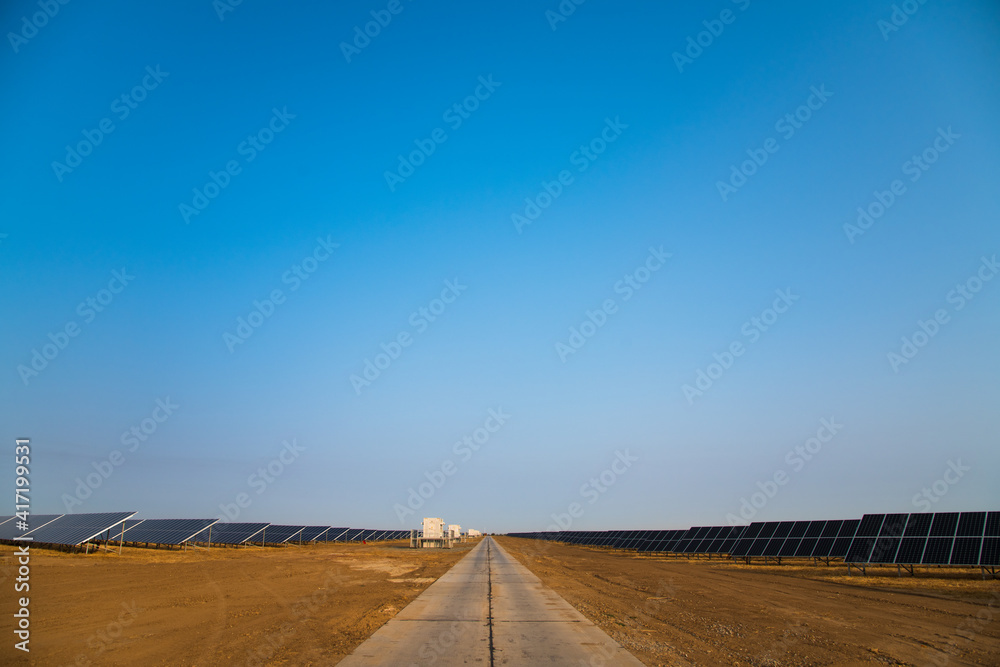 Fototapeta premium Blue solar panels with the sunny sky