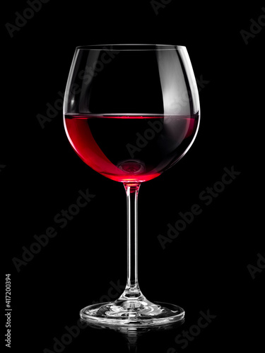 Red wine glass on black background