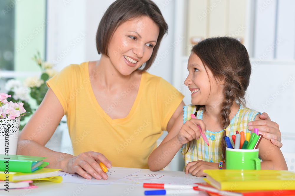 little cute girl with mother drawing at home little cute girl with mother drawing at home
