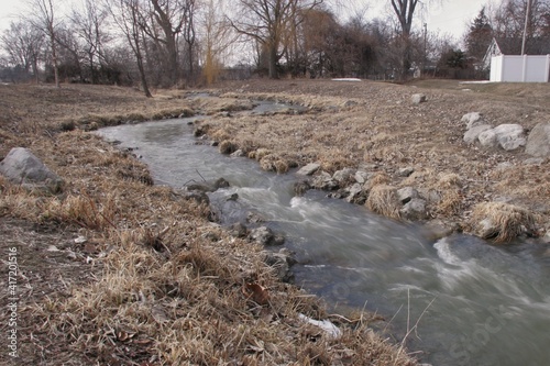 Wallpaper Mural rushing water in a late winter stream Torontodigital.ca