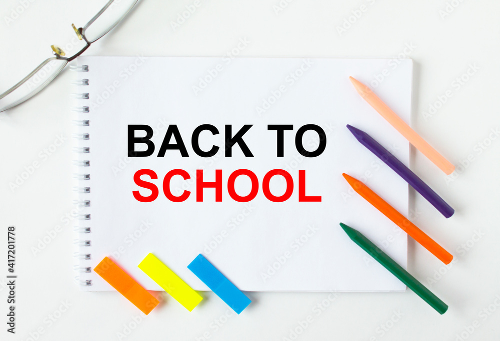 Notepad with text Back To School glasses colored pencils and colored stickers Notepad with text Back To School glasses colored pencils and colored stickers