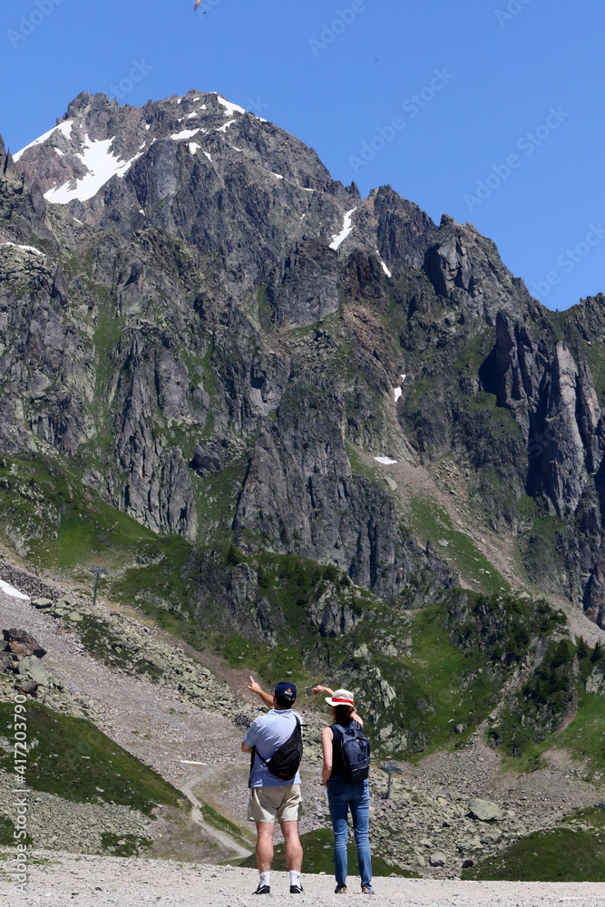French Alps. Mont Blanc Massif. Walkers on a path above the Chamonix Valley, France. 18.07.2016