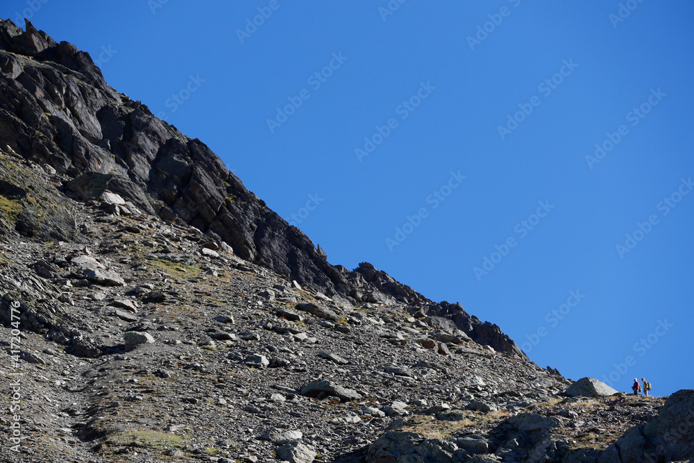 Mountain hikers in summer. Mont Blanc Massif, French Alps. France. 07.06.2018 Mountain hikers in summer. Mont Blanc Massif, French Alps. France. 07.06.2018