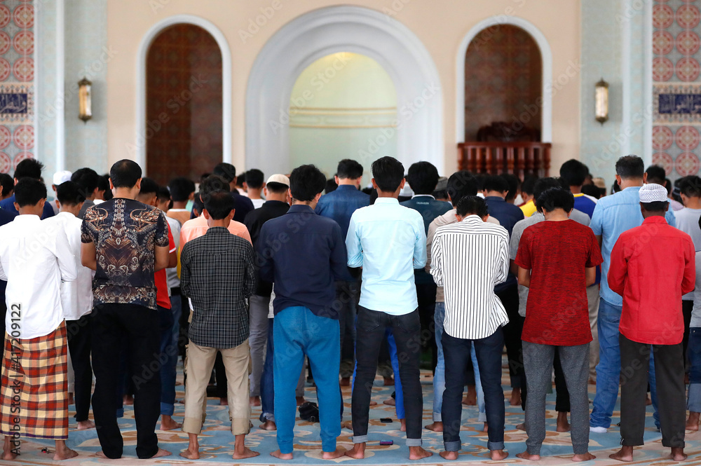 Naklejka premium Al-Serkal Mosque. Muslim men praying for friday prayer. Phnom Penh. Cambodia. 23.11.2018