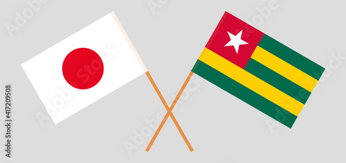 Crossed flags of Japan and Togo. Official colors. Correct proportion