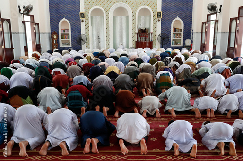 Masjid Ar-Rohmah mosque. Men at the friday prayer (salat). Chau Doc. Vietnam. 21.09.2018