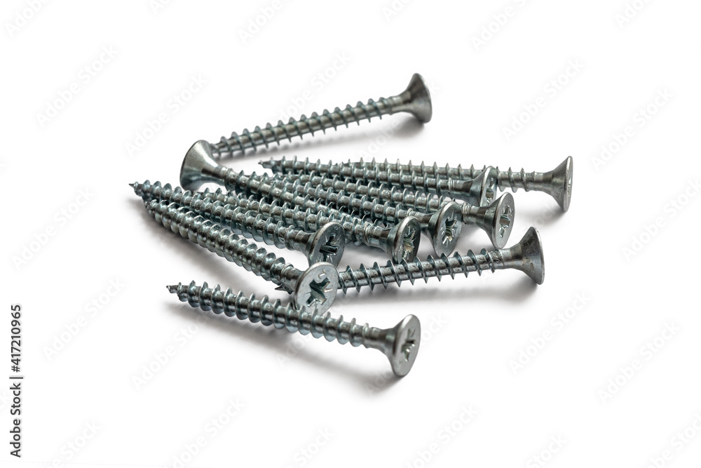 Shiny galvanized self-tapping screws on white background Shiny galvanized self-tapping screws on white background