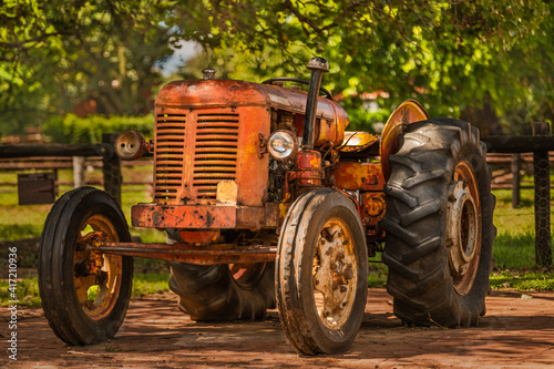 old rustic tractor in a countryside farm