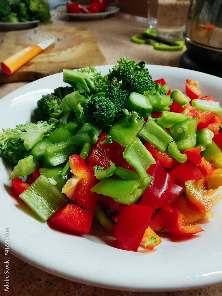 mix of fresh vegetables prepared for cooking. Cooking a meal in a kitchen at home. Healthy diet mix of fresh vegetables prepared for cooking. Cooking a meal in a kitchen at home. Healthy diet