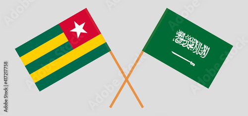 Crossed flags of Togo and the Kingdom of Saudi Arabia. Official colors. Correct proportion