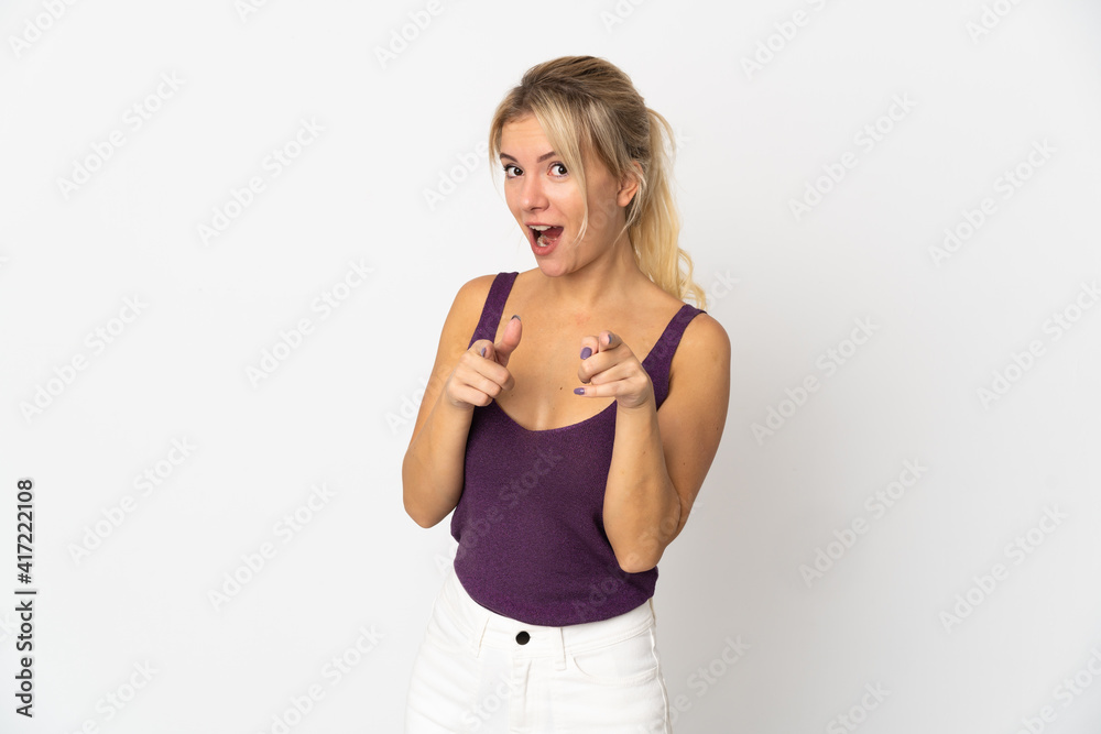 Young Russian woman isolated on white background surprised and pointing front Young Russian woman isolated on white background surprised and pointing front