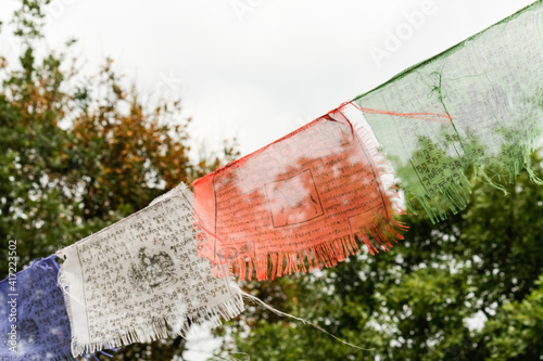 Colorful Tibetan prayer flags in the wind photo