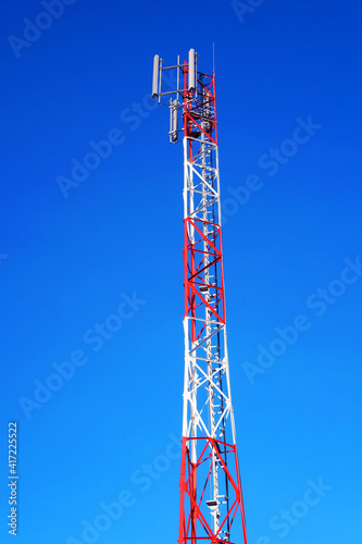 Image of a telecommunication tower against the blue sky
