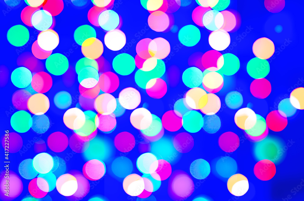 abstract background of blurred warm lights with cool blue and purple background with bokeh effect