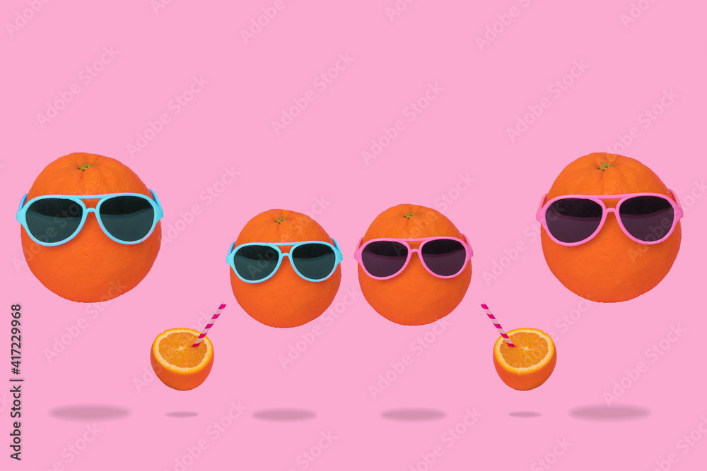 Orange party of fresh fruit, hipster in sunglasses with fresh orange juice, stylish fruit.