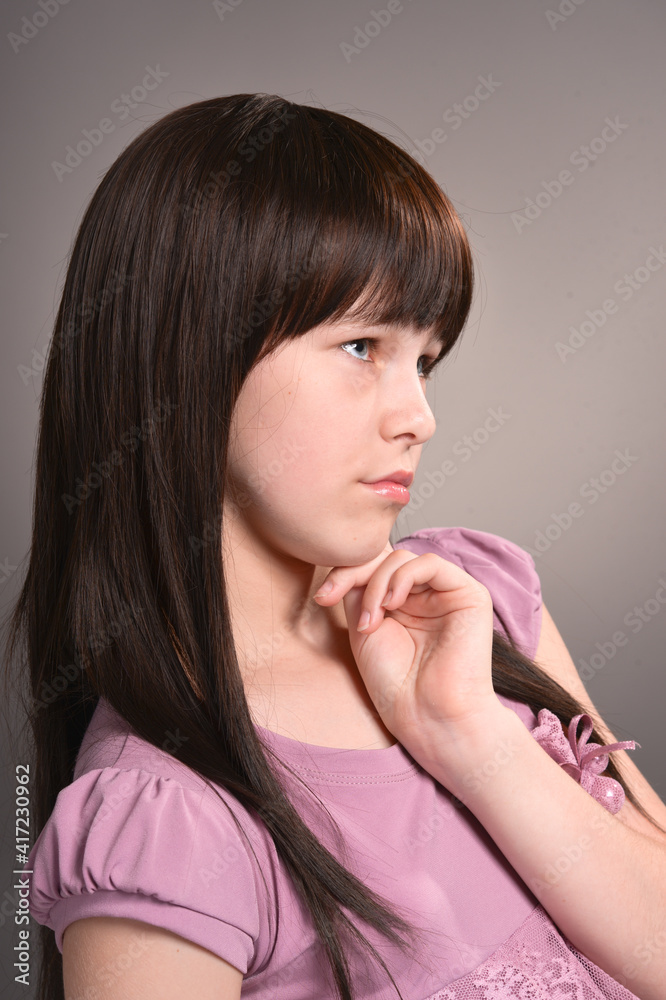 Girl with dark hair posing in studio Girl with dark hair posing in studio
