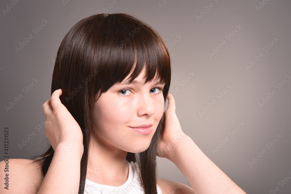 Cute happy girl with dark hair posing Cute happy girl with dark hair posing
