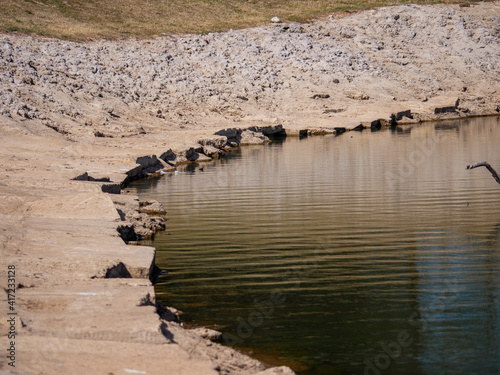 Concrete Cove With Still Water on River Bend