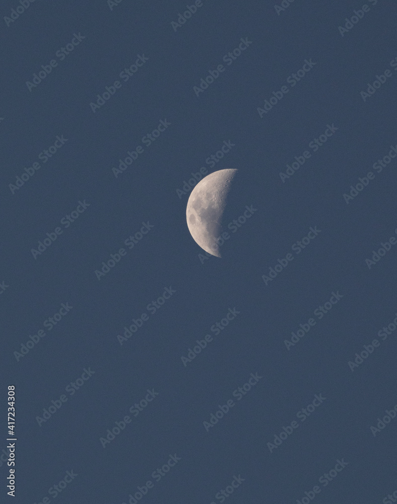 Crescent Moon Illuminated on a Blue Background Crescent Moon Illuminated on a Blue Background