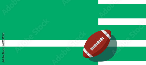 american football ball standing on white line.