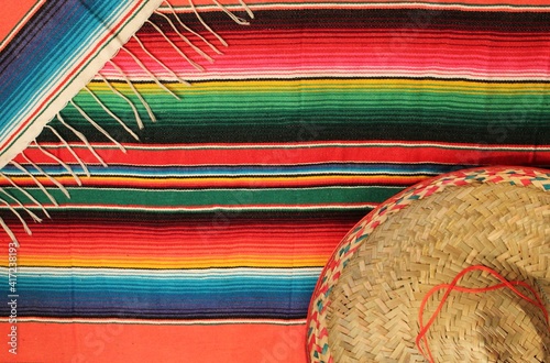 Traditional Mexican fiesta poncho rug  in bright colors with sombrero