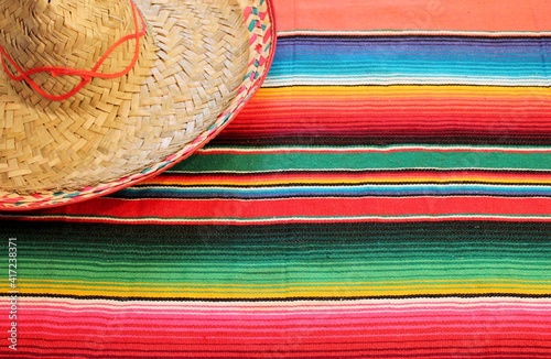 Mexican blanket Mexico poncho sombrero stock background fiesta cinco de mayo blanket serape rug in bright colours with copy space photo flat lay minimal minimalist pattern