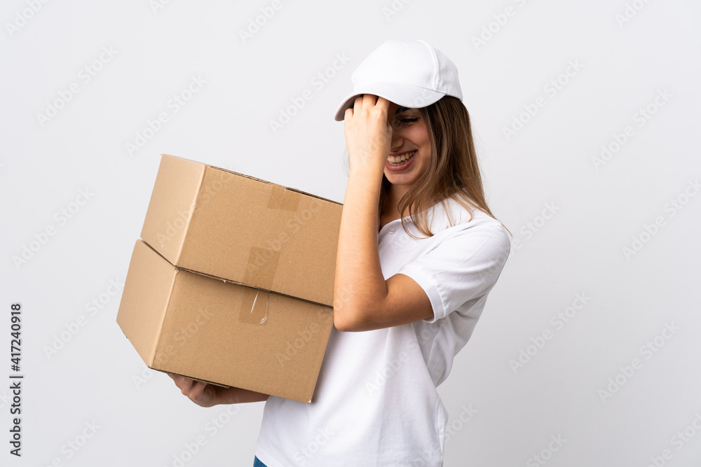 Young delivery woman over isolated white background laughing Young delivery woman over isolated white background laughing