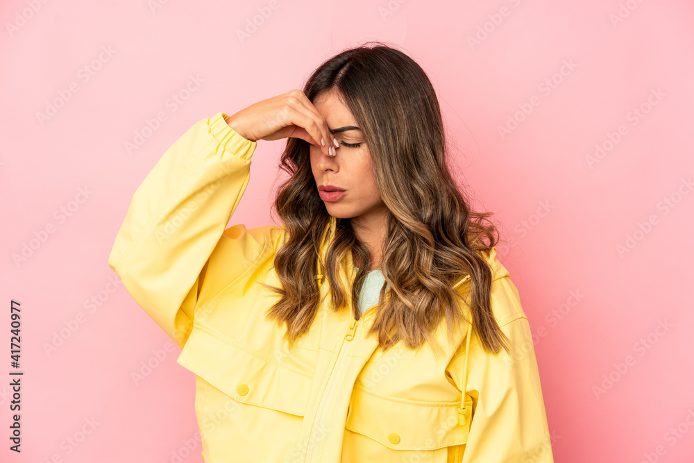 Young caucasian woman isolated having a head ache, touching front of the face. Young caucasian woman isolated having a head ache, touching front of the face.