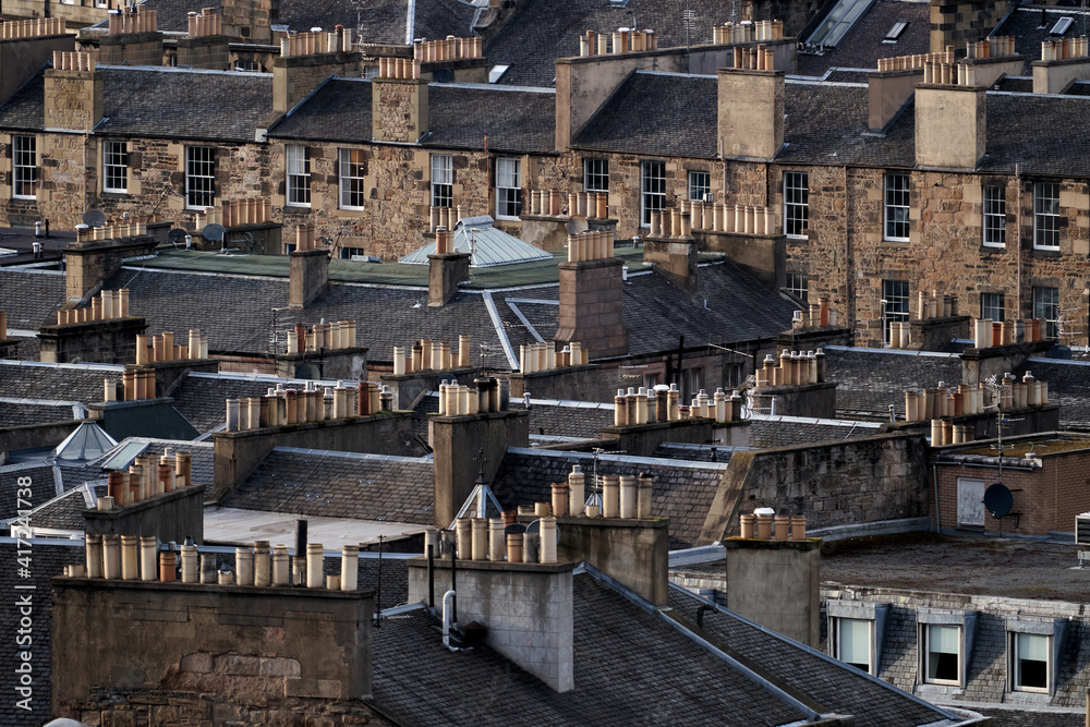 Chimneys on the rooftops of tenement buildings