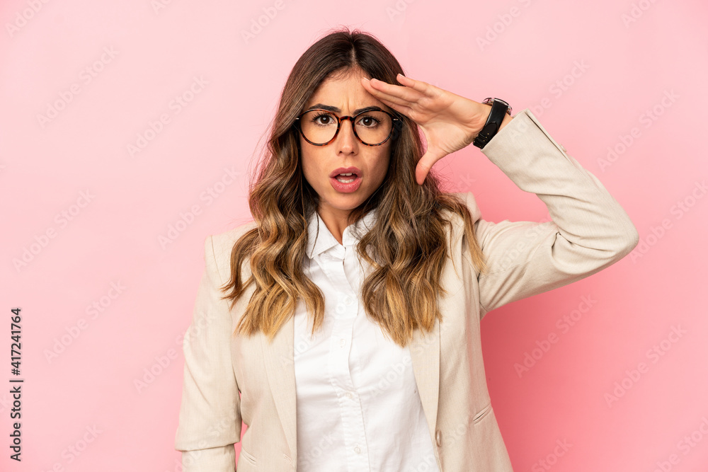 Young caucasian woman isolated looking far away keeping hand on forehead. Young caucasian woman isolated looking far away keeping hand on forehead.