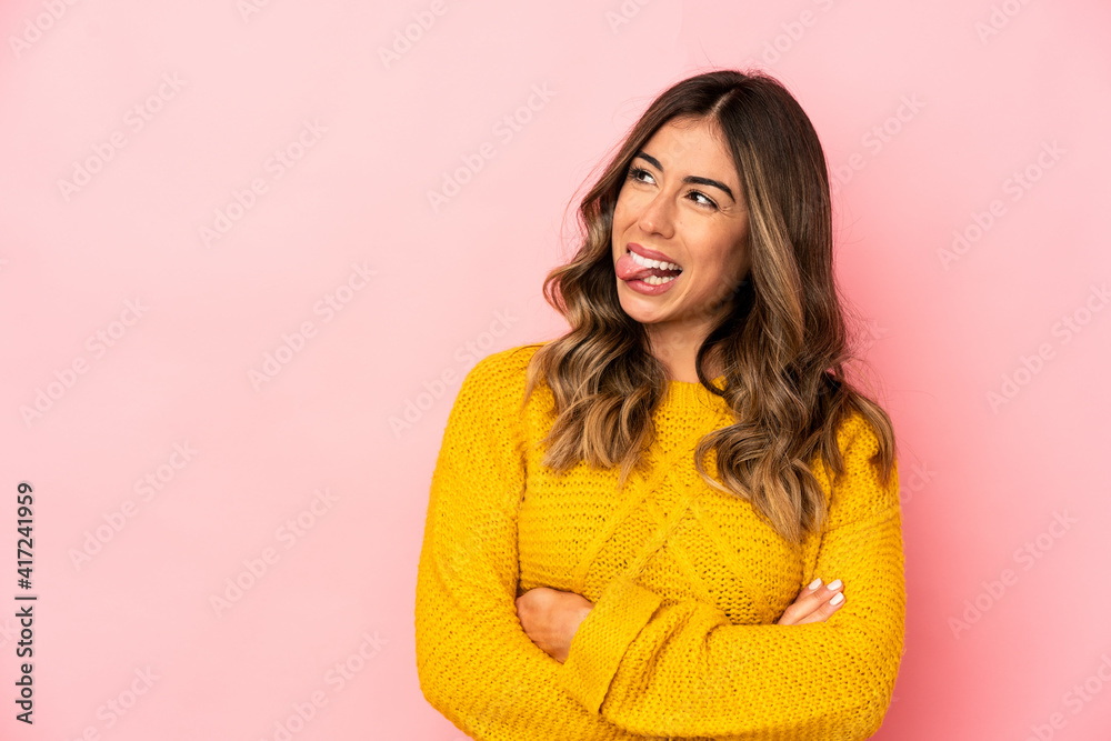 Young caucasian woman isolated funny and friendly sticking out tongue. Young caucasian woman isolated funny and friendly sticking out tongue.