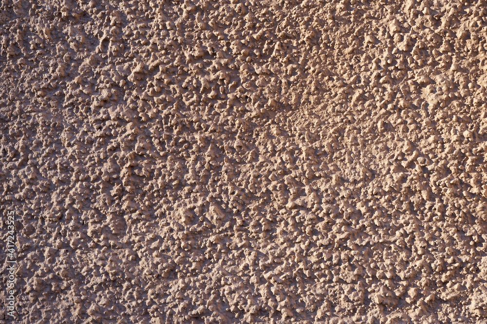 A wall of granite stone as a background. A wall of granite stone as a background.