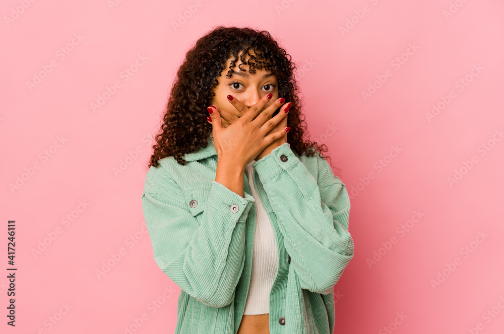 Young african american afro woman isolated shocked covering mouth with hands. Young african american afro woman isolated shocked covering mouth with hands.