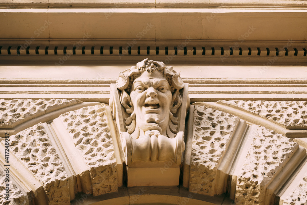 A bas-relief on the facade in the form of a human face.