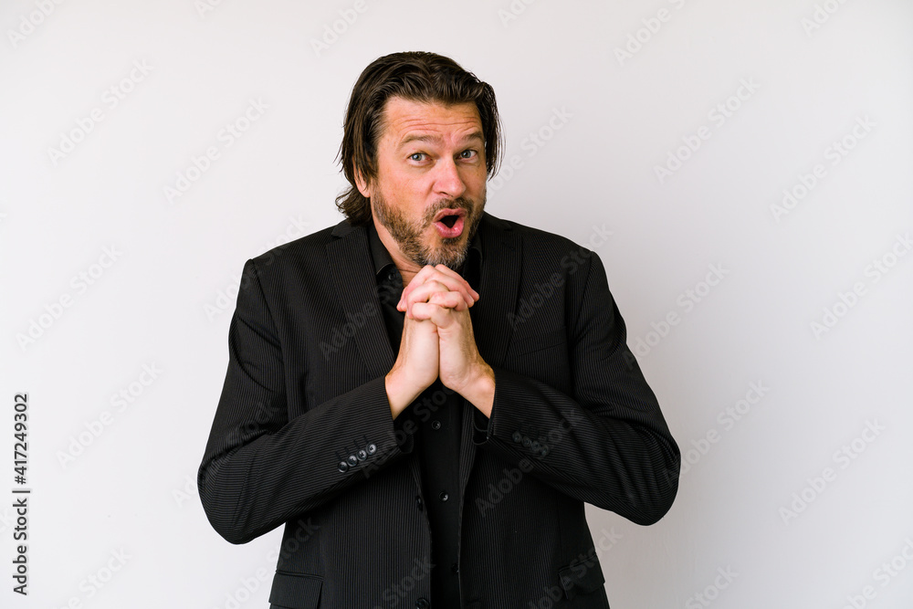 Middle age business dutch man isolated on white background joyful laughing a lot. Happiness concept. Middle age business dutch man isolated on white background joyful laughing a lot. Happiness concept.