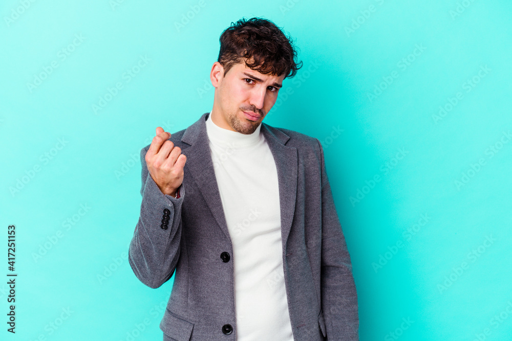 Young caucasian man isolated on blue background showing that she has no money. Young caucasian man isolated on blue background showing that she has no money.