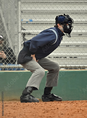 Photography Baseball or Softball umpire calling balls and strikes during a game