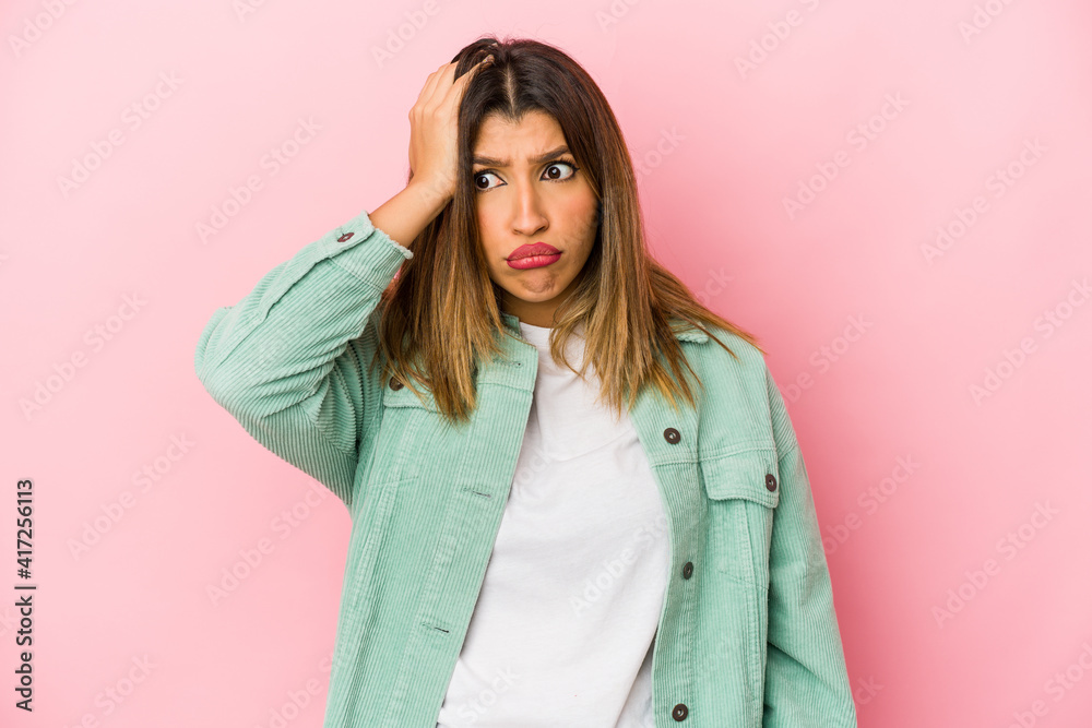 Young indian woman isolated on pink background being shocked, she has remembered important meeting. Young indian woman isolated on pink background being shocked, she has remembered important meeting.