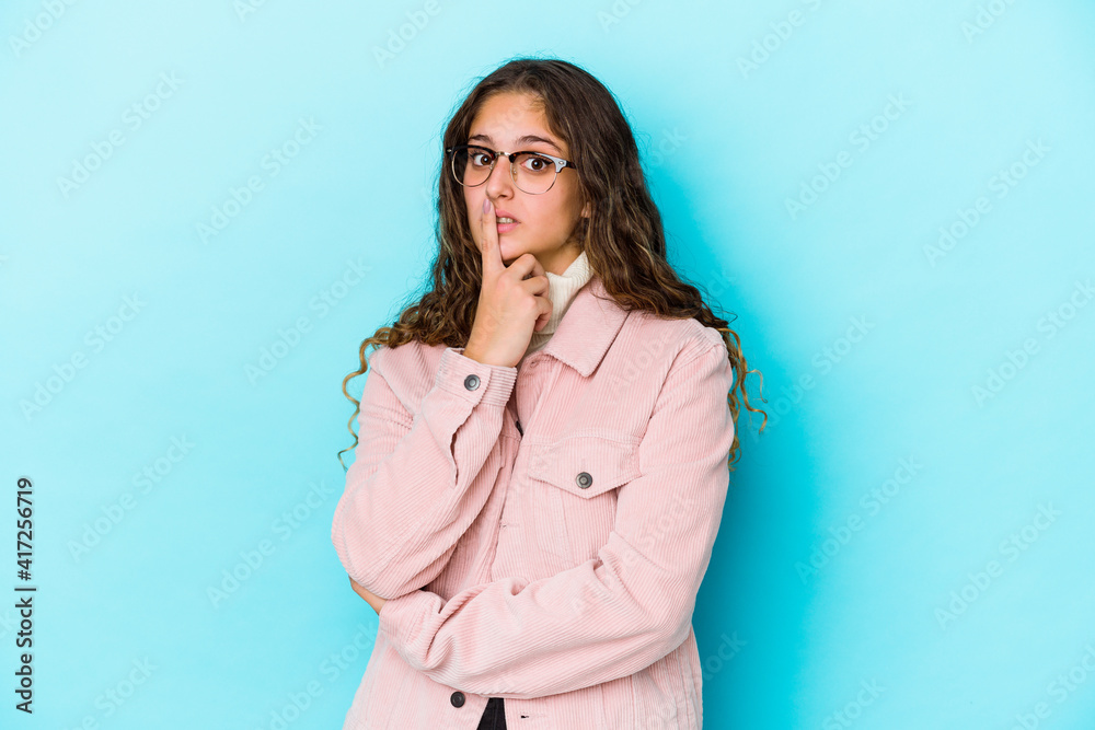 Young caucasian curly hair woman isolated unhappy looking in camera with sarcastic expression. Young caucasian curly hair woman isolated unhappy looking in camera with sarcastic expression.