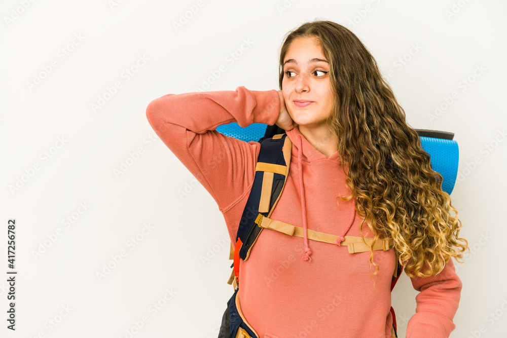 Young caucasian woman ready for a trip isolated touching back of head, thinking and making a choice. Young caucasian woman ready for a trip isolated touching back of head, thinking and making a choice.