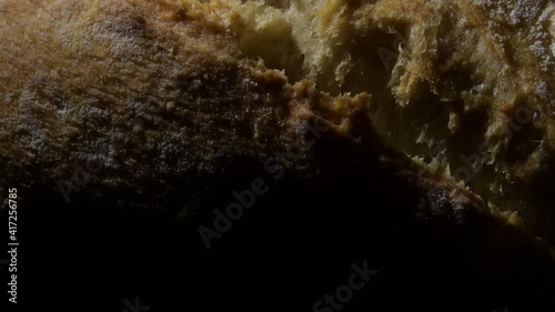 Tasty bread crust with an intimate light turning photo