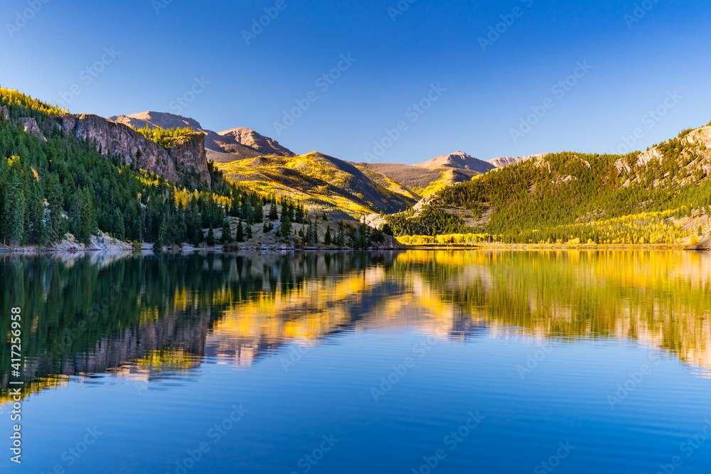 Reflection of aspen trees on Lake San Cristobal in the San Juan Mountains of Colorado
