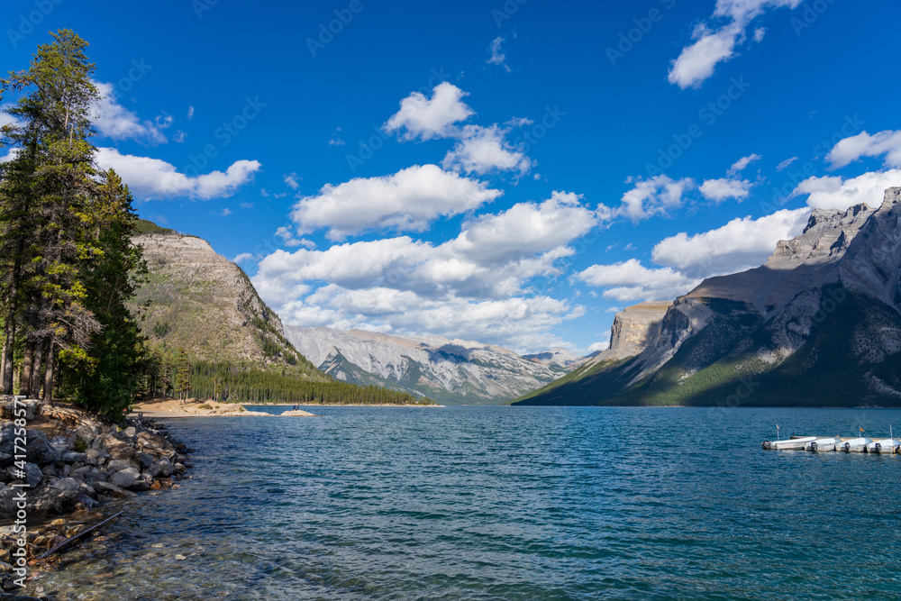 Lake Minnewanka. Famous tourist attraction for leisure activities, boat cruise and mountain trail hiking in Banff National Park, Canadian Rockies. Alberta, Canada.
