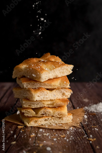 Sliced focaccia bread with salt and olive oil